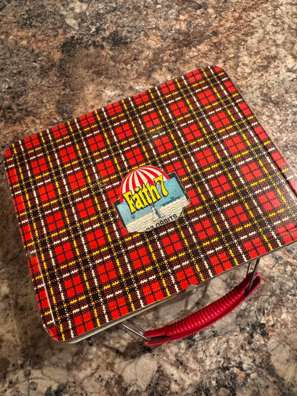 Vintage Ohio Art tin lunchbox with red plaid design.